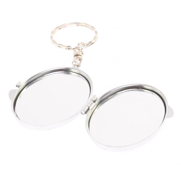 Складное зеркало брелок из камня пегматит овальное 126657